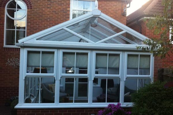 A Gable Front Conservatory, White, Dwarf Wall, With a Full Height Wall