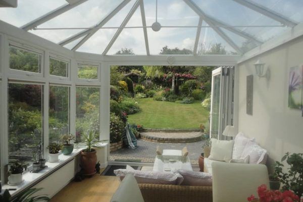 Hipped Back Gull Wing Conservatory, White, Dwarf Wall, Corner with Existing house and Garage