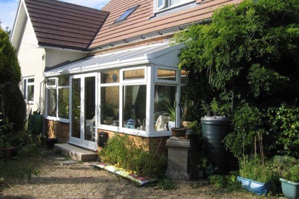 A Lean To Conservatory, White, Corner up to existing house