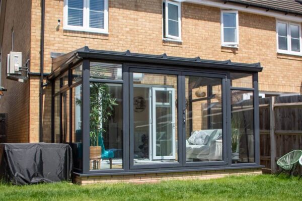 A grey, Lean-to conservatory with bifold doors