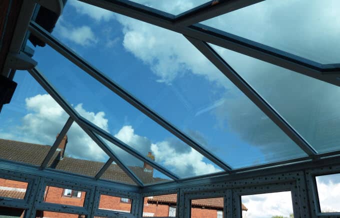 Self-cleaning glass roof for conservatory