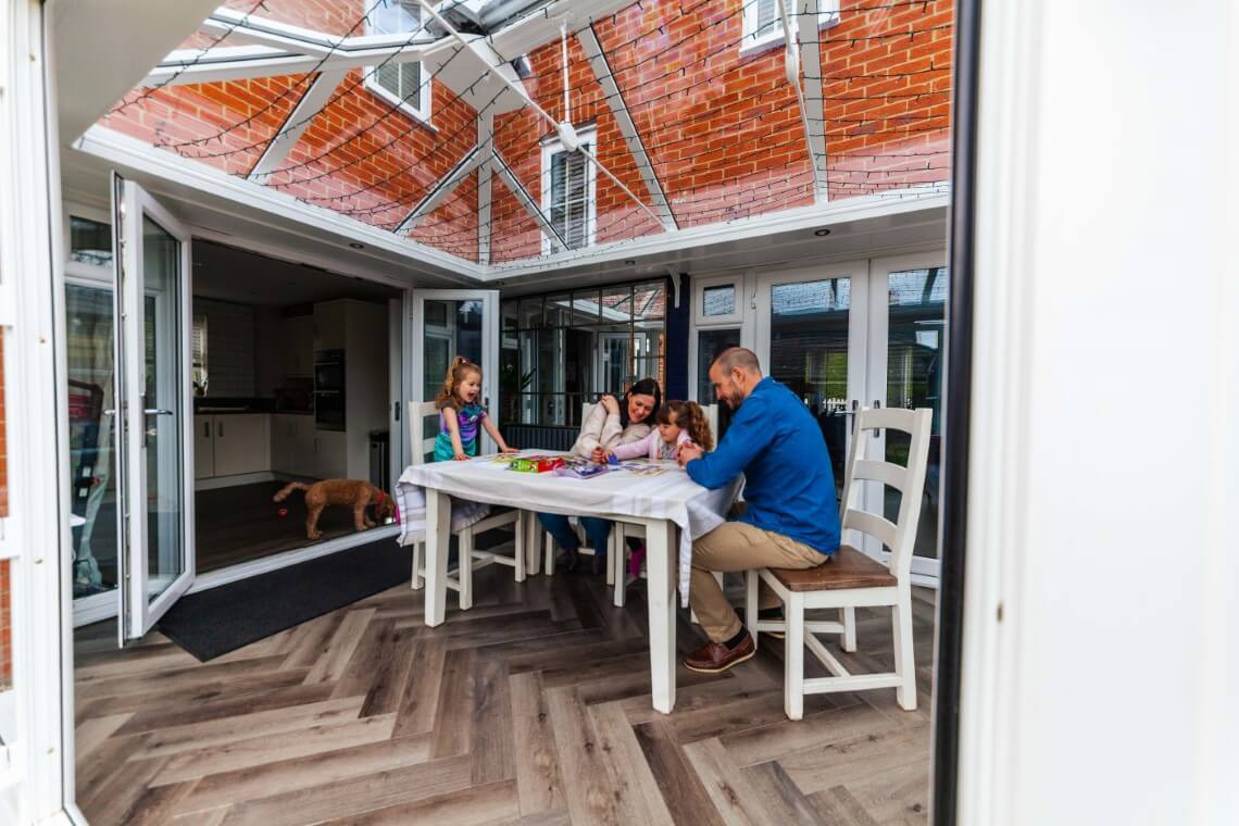 family in conservatory dining room