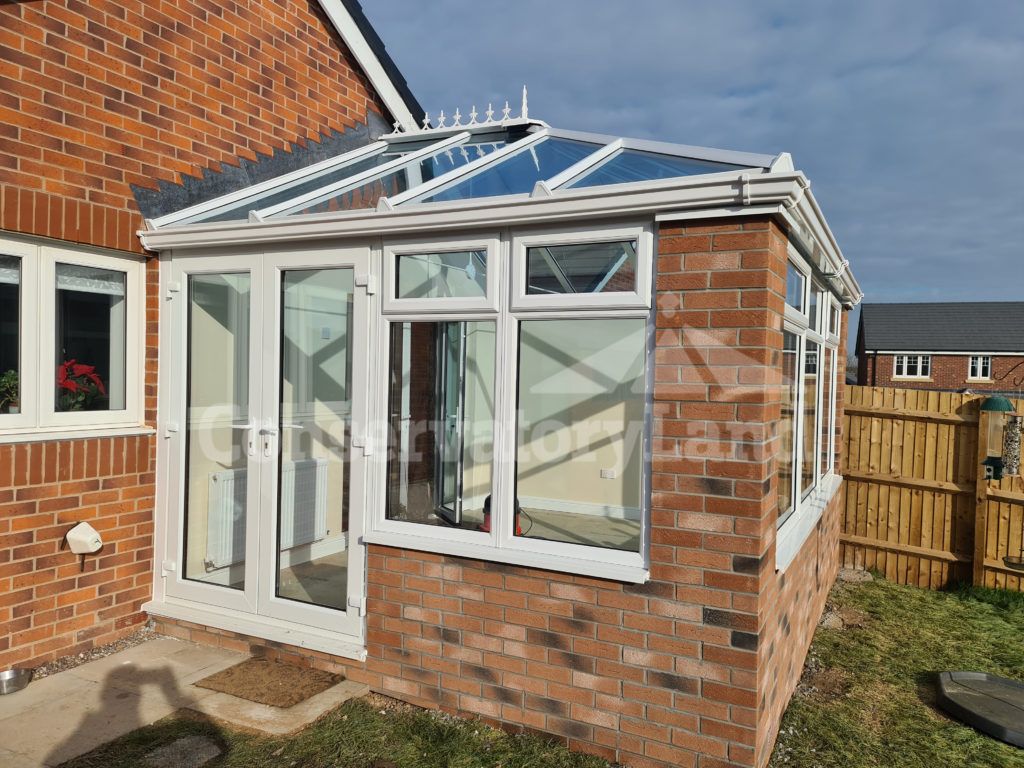 completed edwardian conservatory build with full length double doors