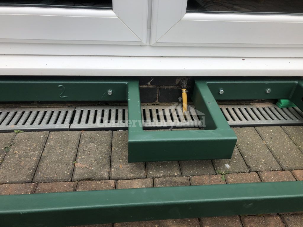 Custom conservatory steel base for heating run-off valve