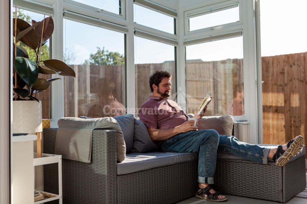 Mr Readman relaxing in his new conservatory
