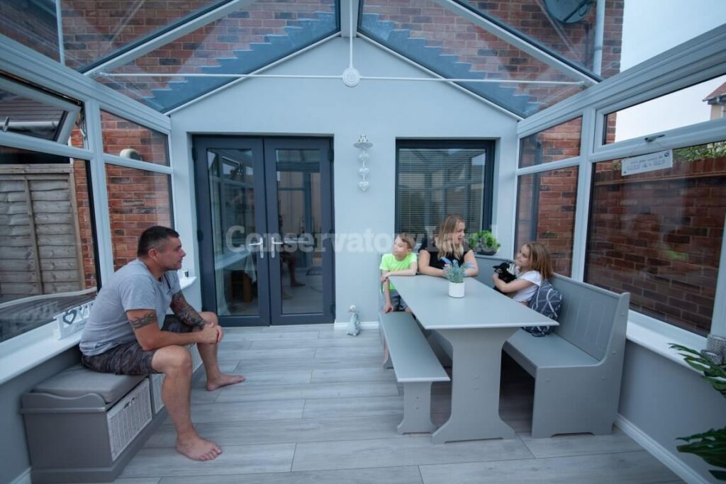 a family inside an Edwardian conservatory