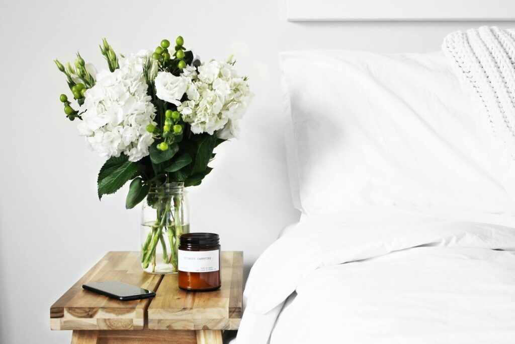 Candle and flowers in the bedroom