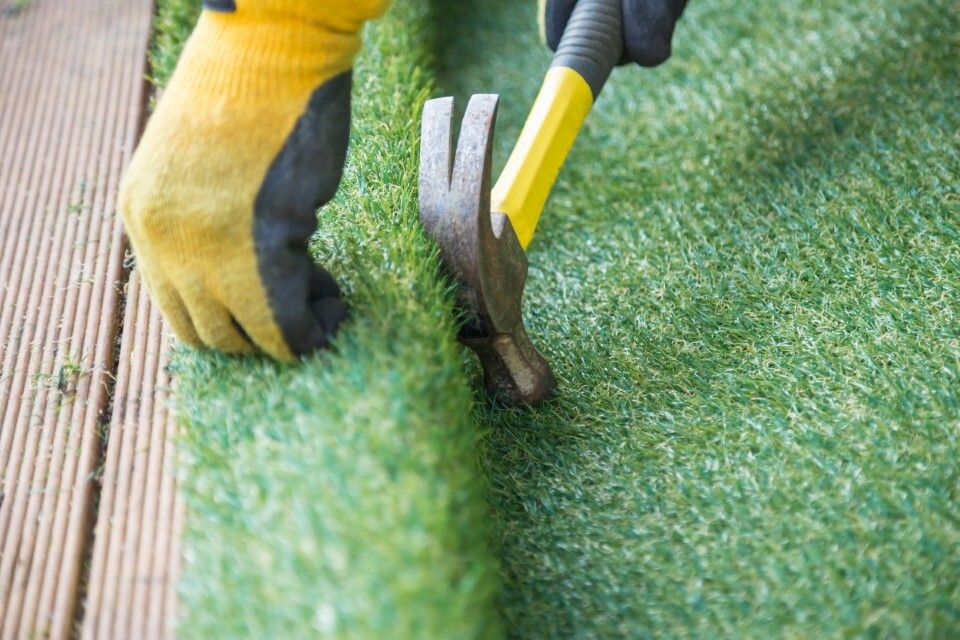 laying artificial grass