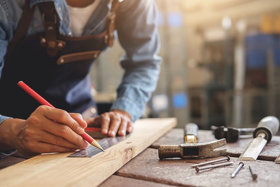 measuring wooden plank shelf